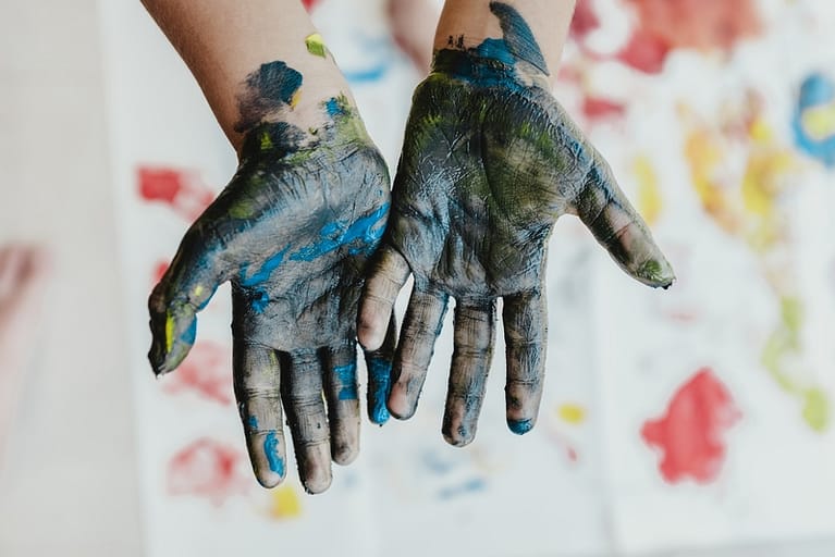 ink-stained, person hands with green paint